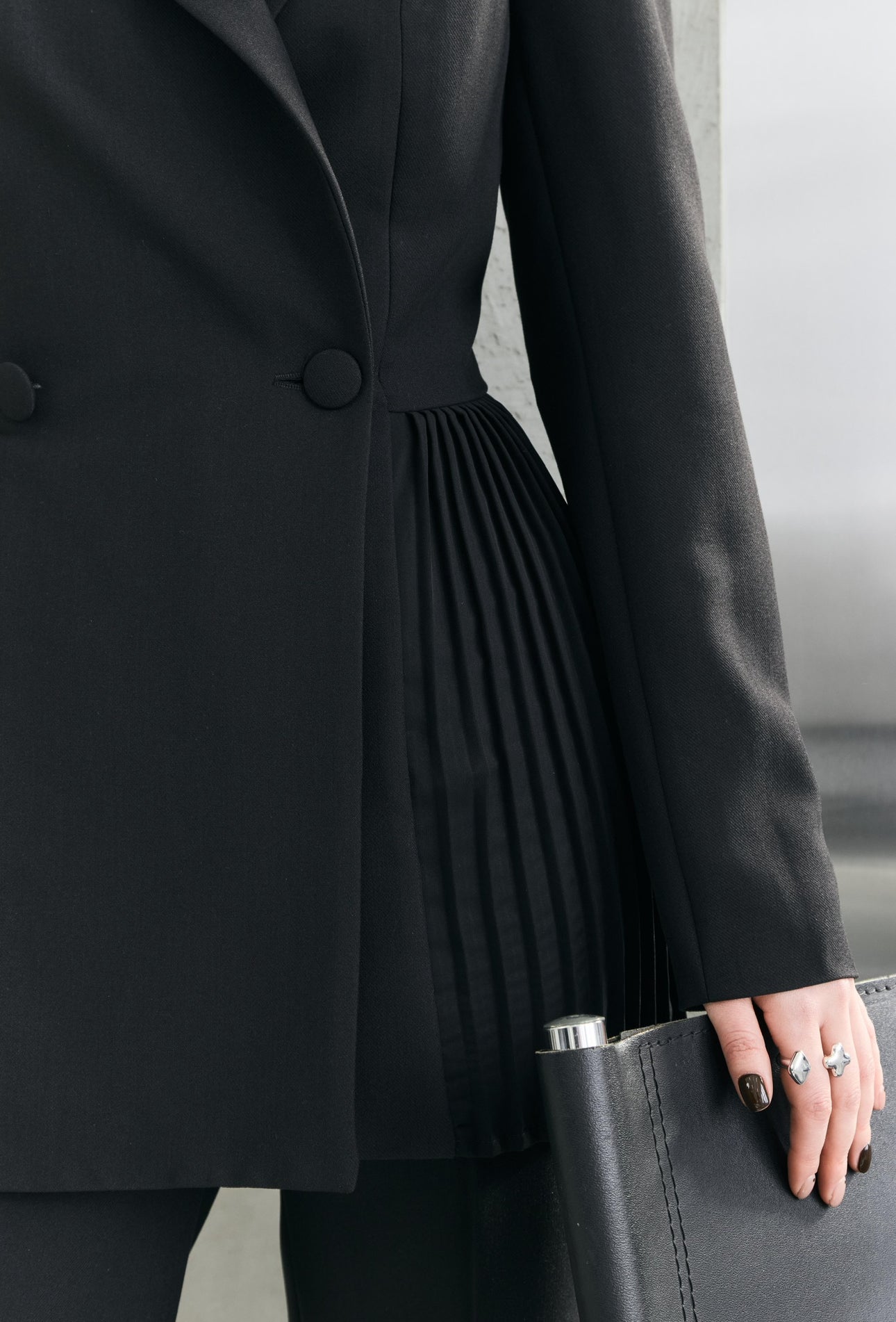 Dominika's black pleated jacket