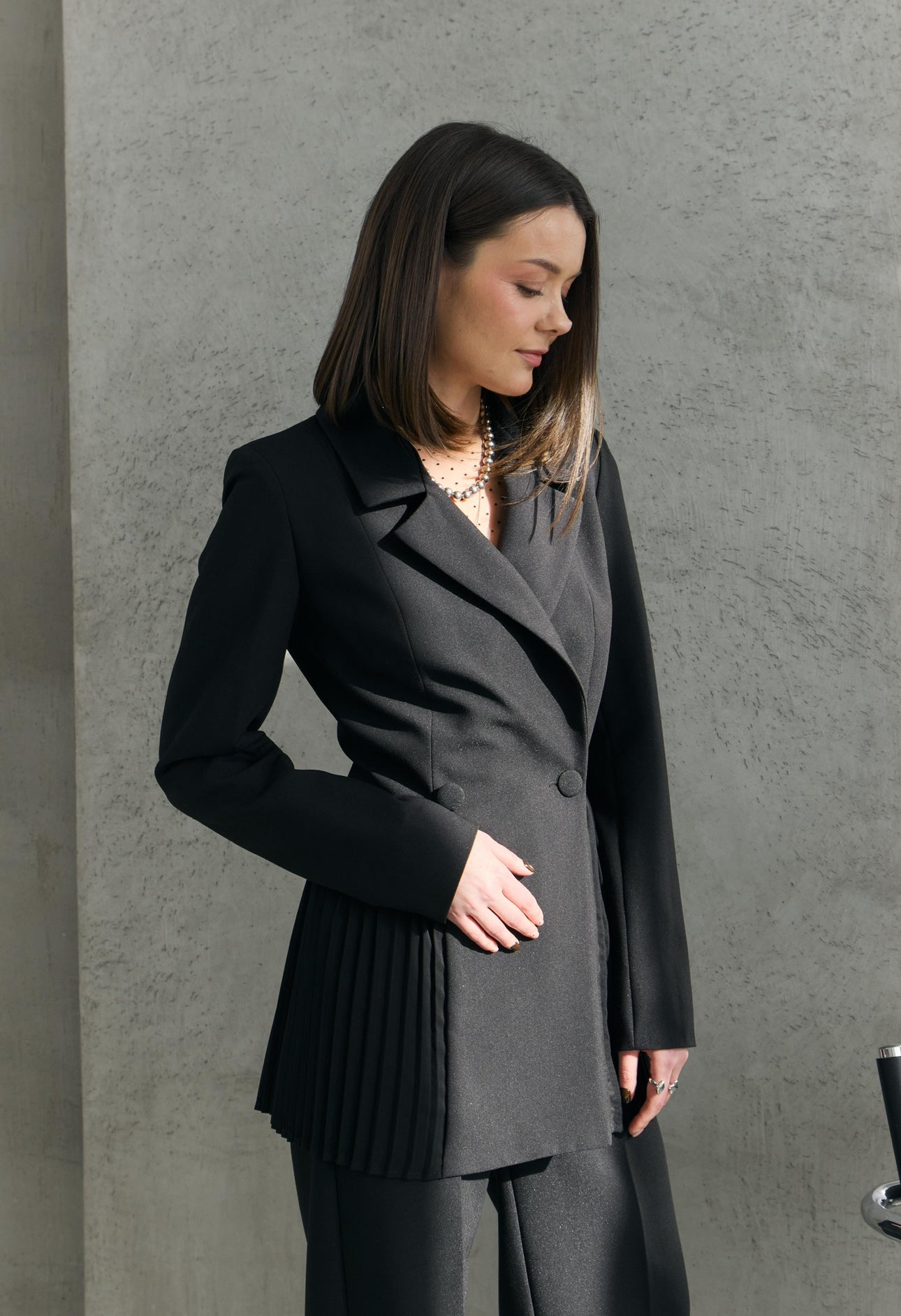 Dominika's black pleated jacket