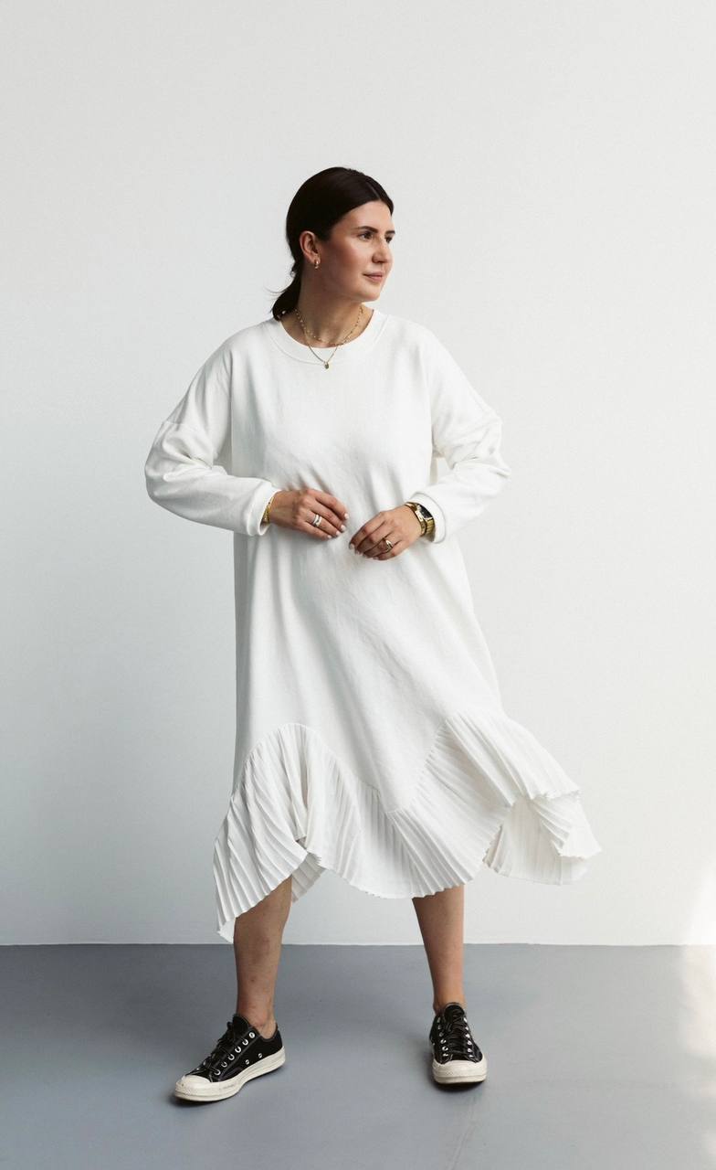 Black warm dress made of knitwear, decorated silk pleats