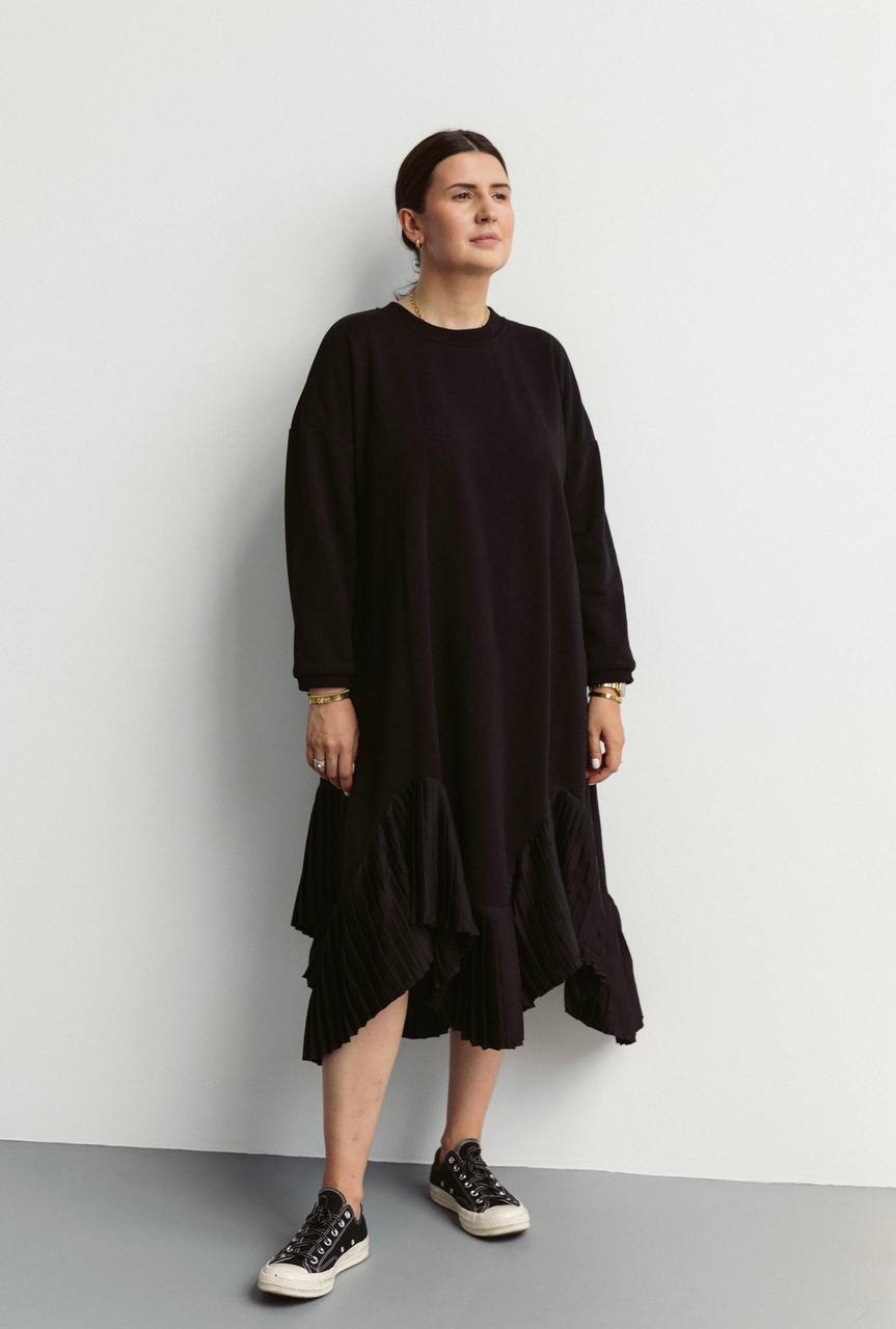 Black warm dress made of knitwear, decorated silk pleats