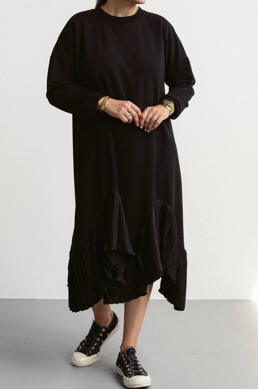 Black warm dress made of knitwear, decorated silk pleats