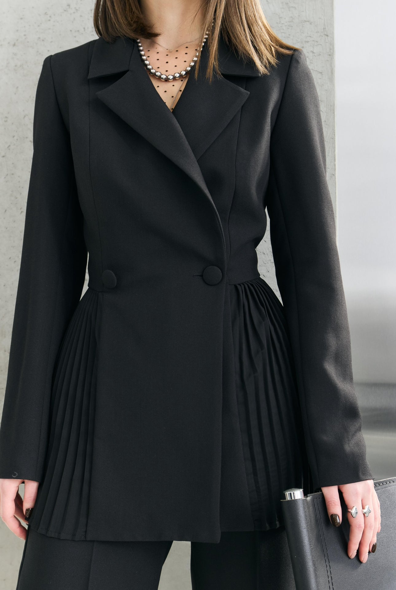 Dominika's black pleated jacket